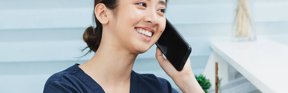 A smiling healthcare professional in a bright clinical setting